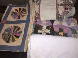 several fine hand made quilts and a lovely "Martha Washington" white coverlet
