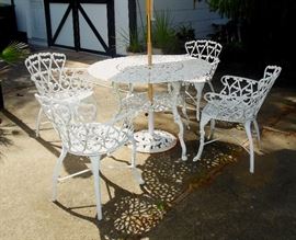 Outdoor Table and Four Chairs With Umbrella Stand
