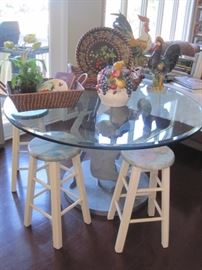 Glass topped table and stools. 