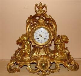 Gold leaf French mantle clock with cherubs