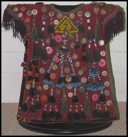  Child's ceremonial garment from Turkey. Includes beads, bells, buttons, and metals.
