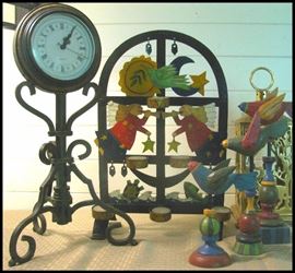 Decorative candle holders, clock and carved whimsical birds