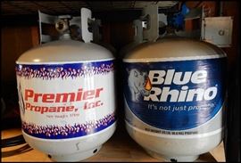  Four canisters of propane 15 to 17 pound containers