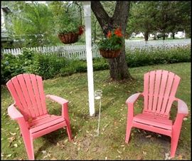  Lawn chairs and hanging plants and shepherd's hooks