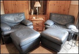 Two very comfortable leather chairs with ottomans