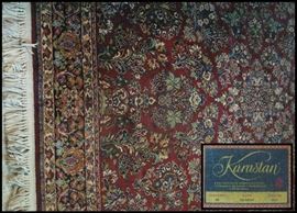  Wool rug by Karastan with Red Sarouk pattern 5 feet nine by nine feet