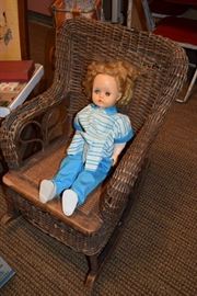 Child's wicker rocker and doll
