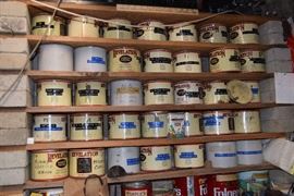 Vintage tobacco tins filled with a variety of nuts and bolts