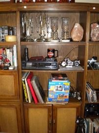 Book case, crystal lamps, Sony camera DVD player and books.