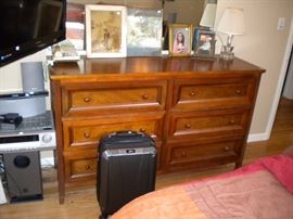 Dresser, pictures and electronics.