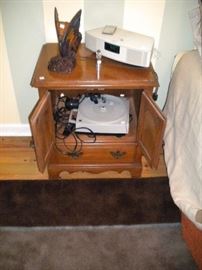 night stand. lamp and electronics.
