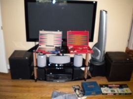 50 inch flat screen TV. Stereo, speakers and back gam on games.