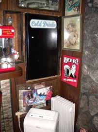 Small fridge, popcorn maker and signs