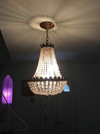 One of  two matching period Empire chandeliers.  Nice.