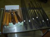Woodworking tools on left, blacksmith tools on right