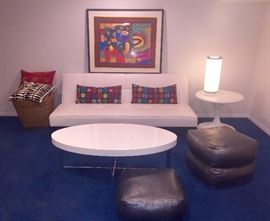 White Faux Leather tufted sofa / sofa bed, white acrylic table, pillows