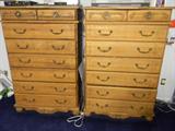 2 tall chests of drawers - 1 has drop down area that serves as a desk