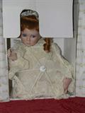 Collectible red haired doll with parasol in original box in very good condition