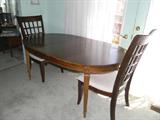 dining room table with two leaves (shown with one) and 4 side chairs