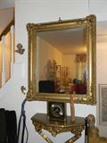 beautiful mirror and small shelf.
