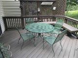 Metal patio table with 4 chairs (2 additional chairs available).