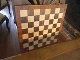 chess / checker board is on opposite side of pull out top