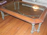 stately glass, wood, and metal coffee table