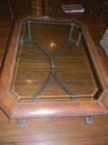 stately glass, wood, and metal coffee table