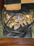 hand-crafted handbag in leather with beautiful stones mounted in metal