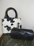 fun pinto pony handbag and small black tube toiletry case by Oscar de la Renta