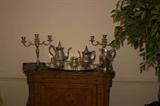 coffee and tea set in silverplate with two candelabra