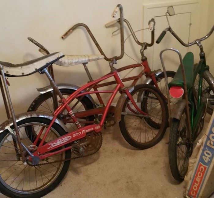 3 bikes just primed for restoration: a Firestone GTO Flame, a Columbia Playbike (green), and a Schwinn ... stingray?