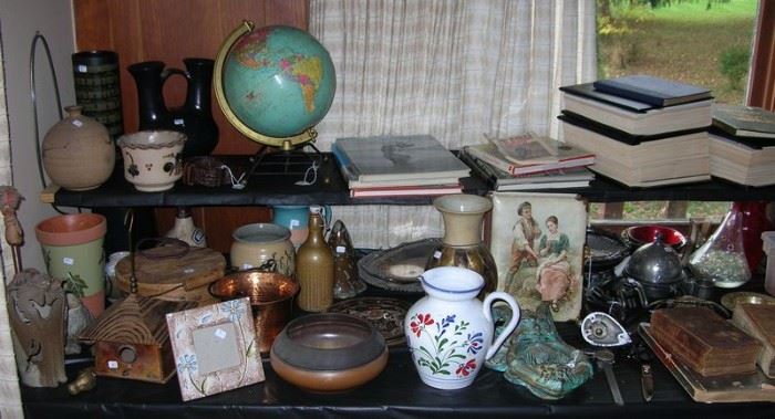 Pottery, vintage globe, vintage books on nude photography
