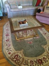 area rub, square glass-topped coffee table
