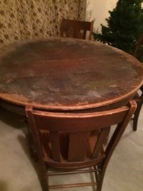 old oak round table with 4 leaves & 3 chairs