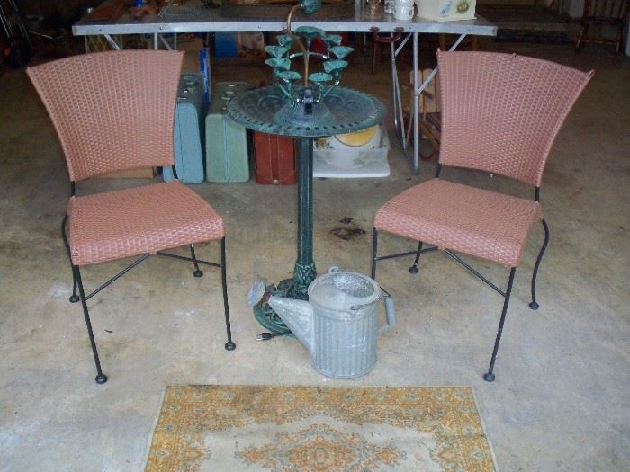 pair of outdoor chairs, fountain and more