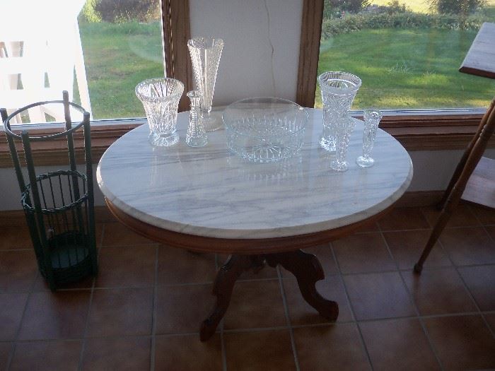 marble top table, umbrella stand, glassware