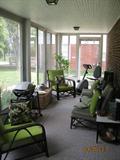 Great Sun Room filled with Vintage Ficks Reed Co. bamboo furniture, an eliptical bike, Weber electric grill and much more.