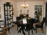 Dining Room loaded with crystal, china, artwork and furniture.