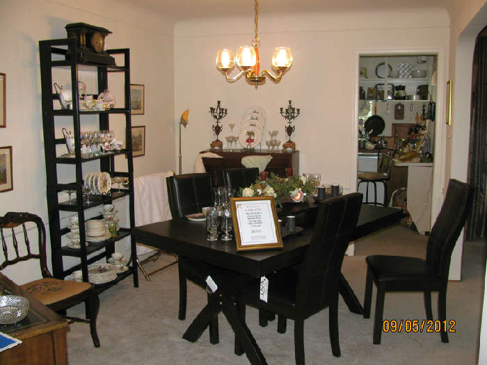 Dining Room loaded with crystal, china, artwork and furniture.