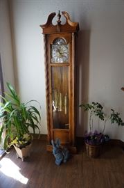 grandfather clock, plants, rabbit