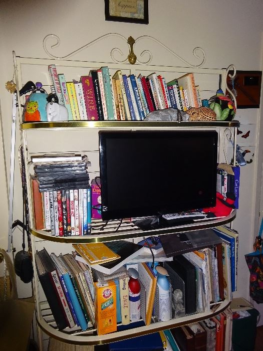cook books and metal shelf unit   flat screen tv