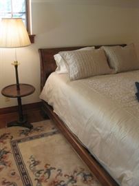 Queen size sleigh bed complete with all the bedding.