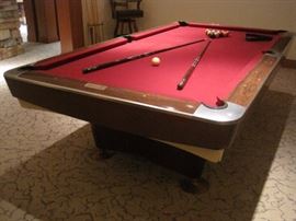 Brunswick pool table with cues and racks. Buy it now for $750. Call 952-261-6461 to schedule an appointment.
