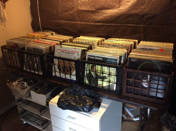 Cases of vintage vinyl including top artist from multiple decades.