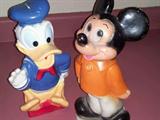 A collection of Disney character banks....plaster and rubber plastic.