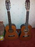 A Winston Guitar on the left with a Winston marking with a 22 inside.   And a Castilla guitar on the right.