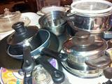 Pots and pans, cooking utensils, and lots of them.
