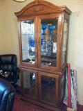 Attractive Hutch with Glass shelves and Mirrored Back.  Quality and in good condition.
