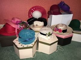 Beautiful assortment of vintage ladies hats and boxes.